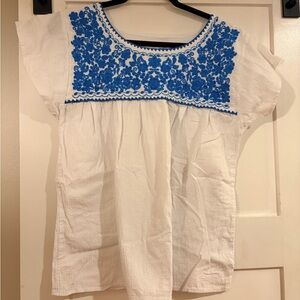 White Blouse with Navy Trim and Embroidered Accent